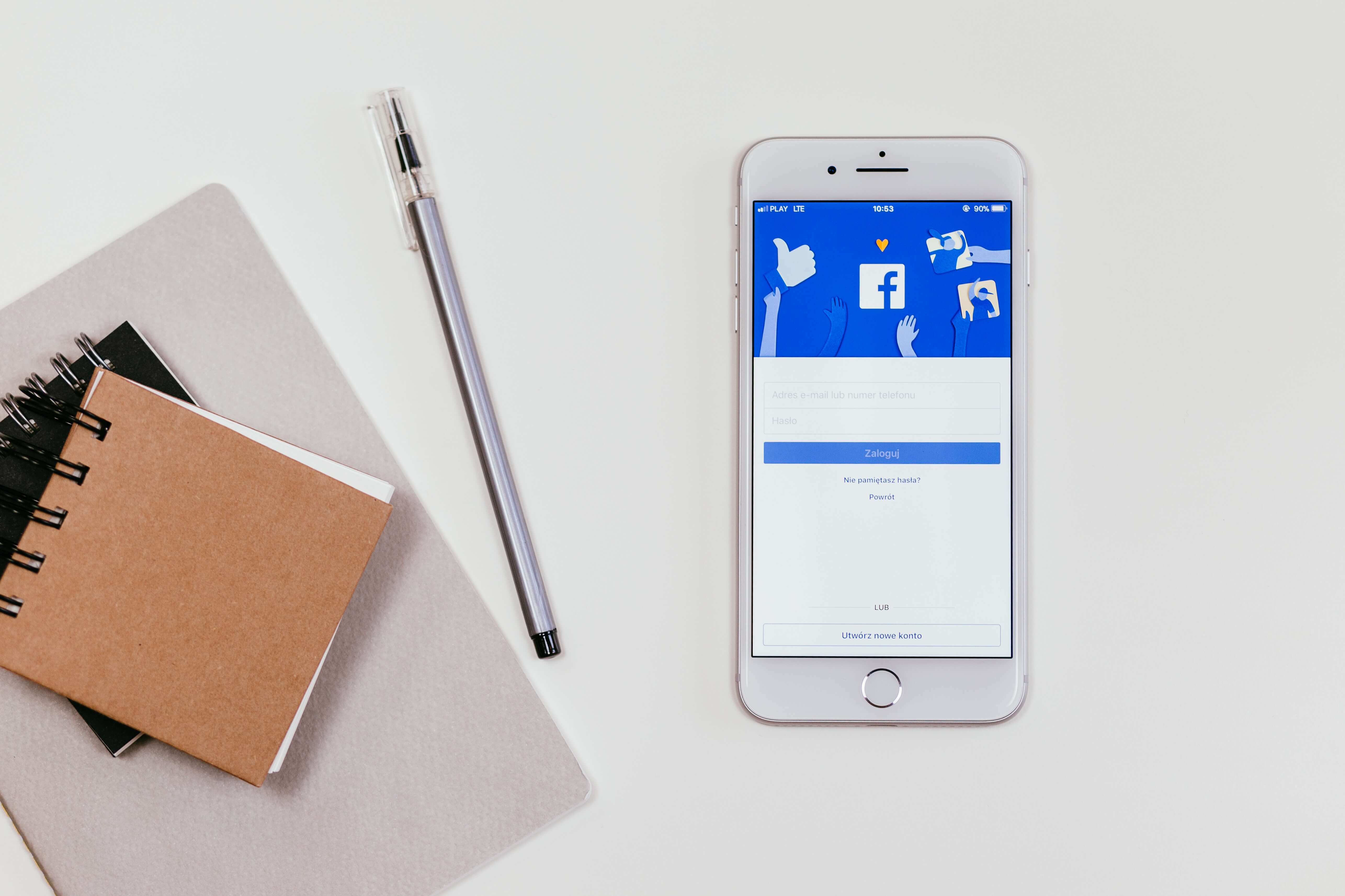 Cellphone showing Facebook login screen.